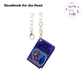 Handbook for the Dead Acrylic Charm